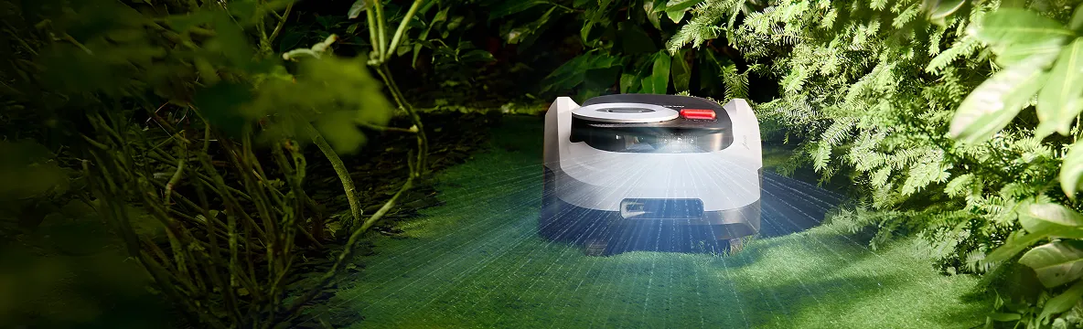 Segway Navimow i2 LiDAR drives through a shaded garden area
